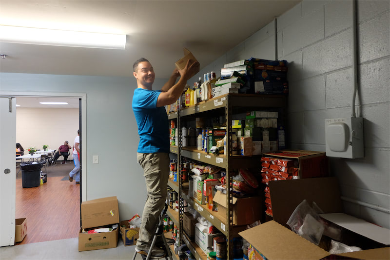 Restocking and organizing the pantry at PADS of Elgin.