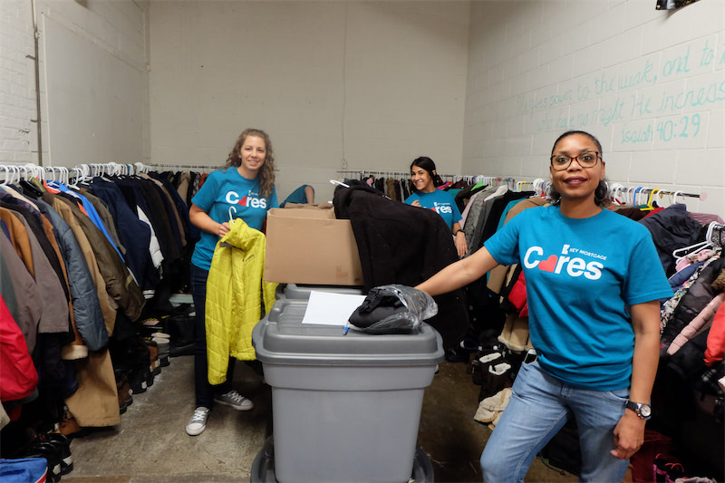 Organizing and cleaning the coat donation room at PADS of Elgin.