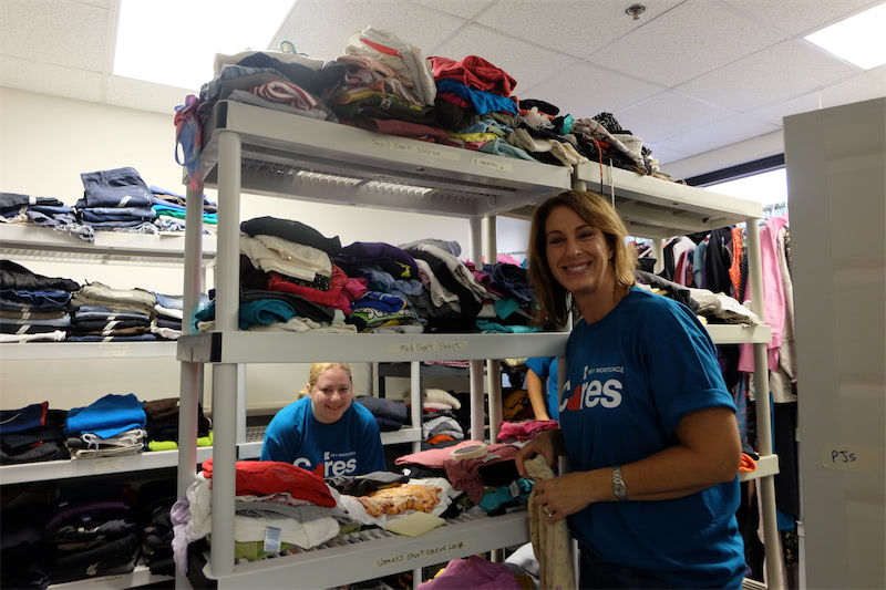 Cleaning and organizing the clothing donation room at PADS of Elgin.