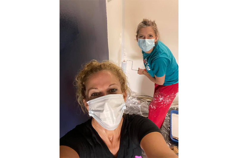 Painting a room for a teen with cancer through Special Spaces of Illinois.