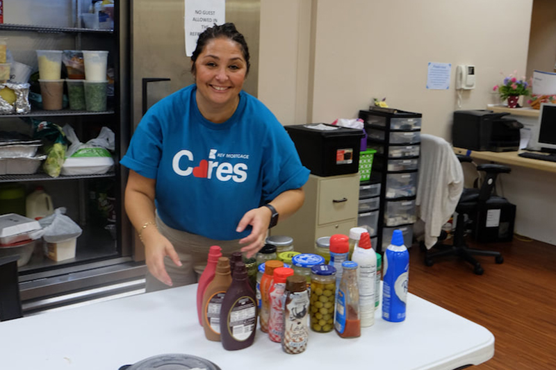 Cleaning and reorganizing the kitchen at PADS of Elgin.