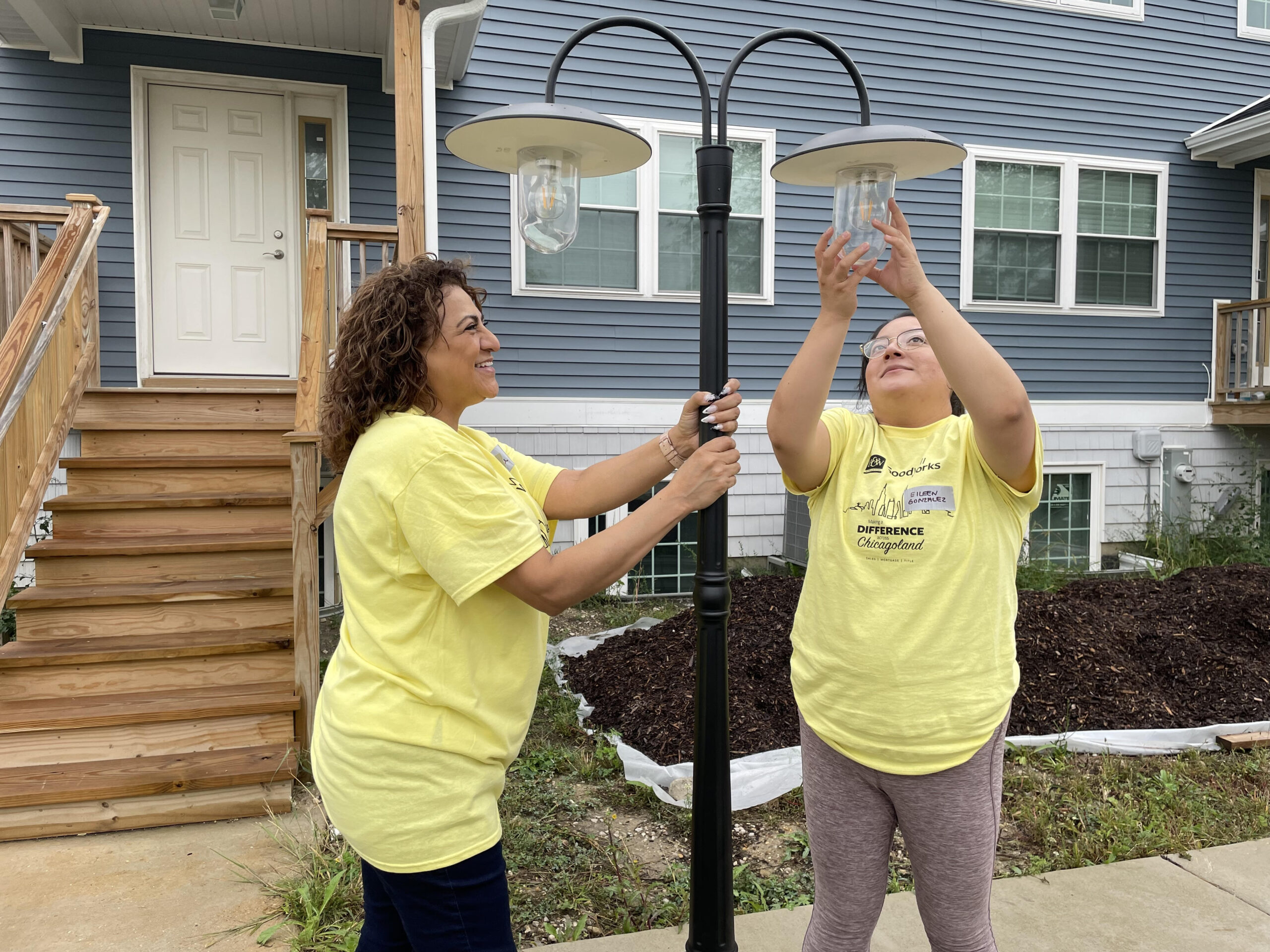 Installing lamps in Hanover Park for Habitat for Humanity